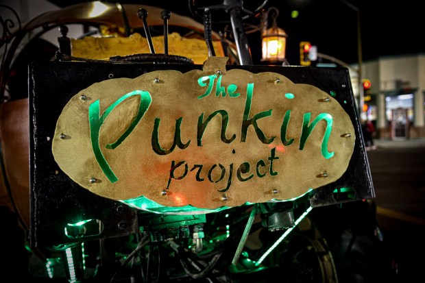 The Punkin Project sign in front of the pumpkin-shaped, steampunk-style carriage. (Stephanie Ogilvie)