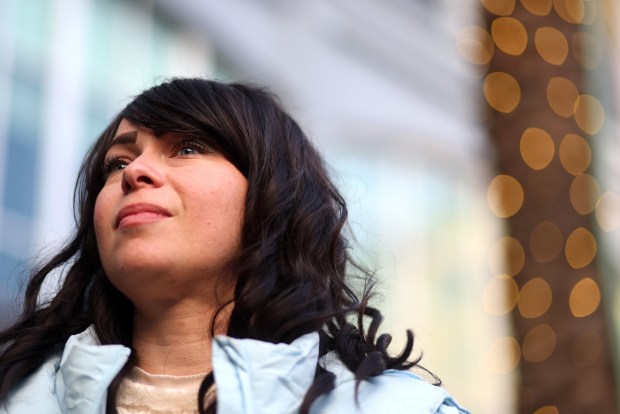 Tovah Emunah takes part in a first night of Hanukkah celebration at Santana Row on Sunday, Dec. 14, 2025, in San Jose, Calif. Over a hundred community members gathered at the menorah-lighting event. (Aric Crabb/Bay Area News Group)