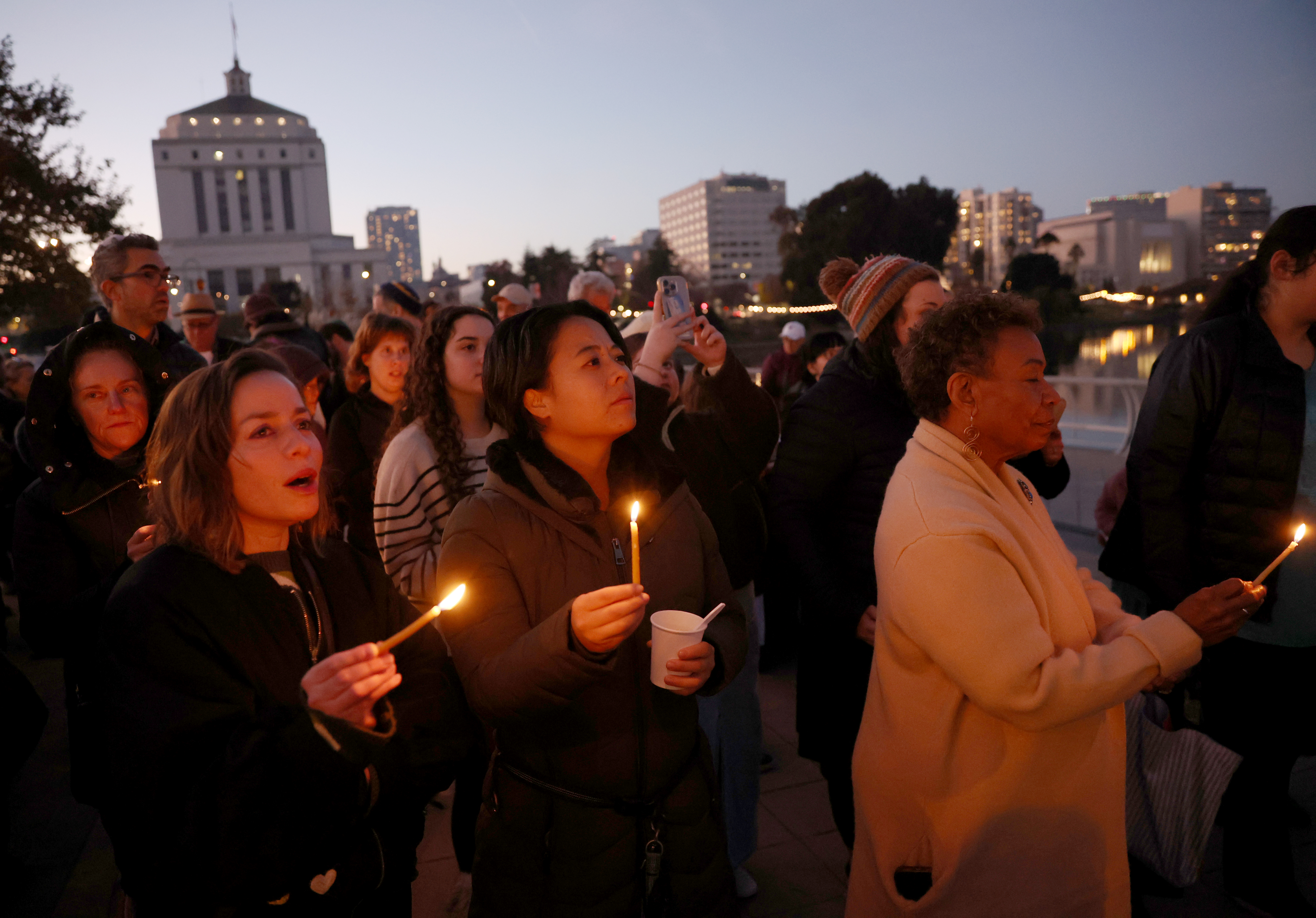 District 2 Councilmember Charlene Wang, center, Mayor Barbara Lee, right,...