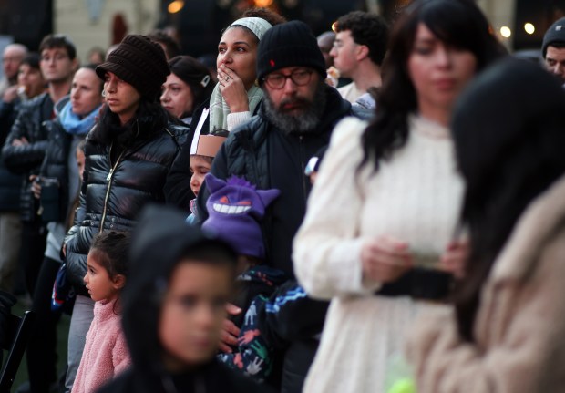 Community members gather on the first night of Hanukkah for a menorah-lightning ceremony at Santana Row on Sunday, Dec. 14, 2025, in San Jose, Calif. (Aric Crabb/Bay Area News Group)