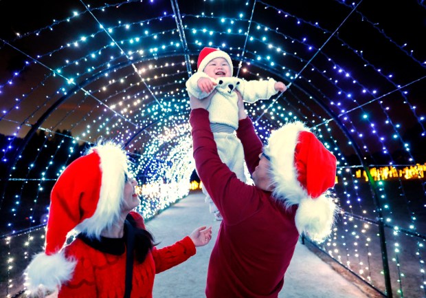 Hao Wu, of San Carlos, holds son Ethan Wu, then 14 months old, with Zoe Liu, during 2022 holiday season events at Filoli in Woodside. (Shae Hammond/Bay Area News Group archives)