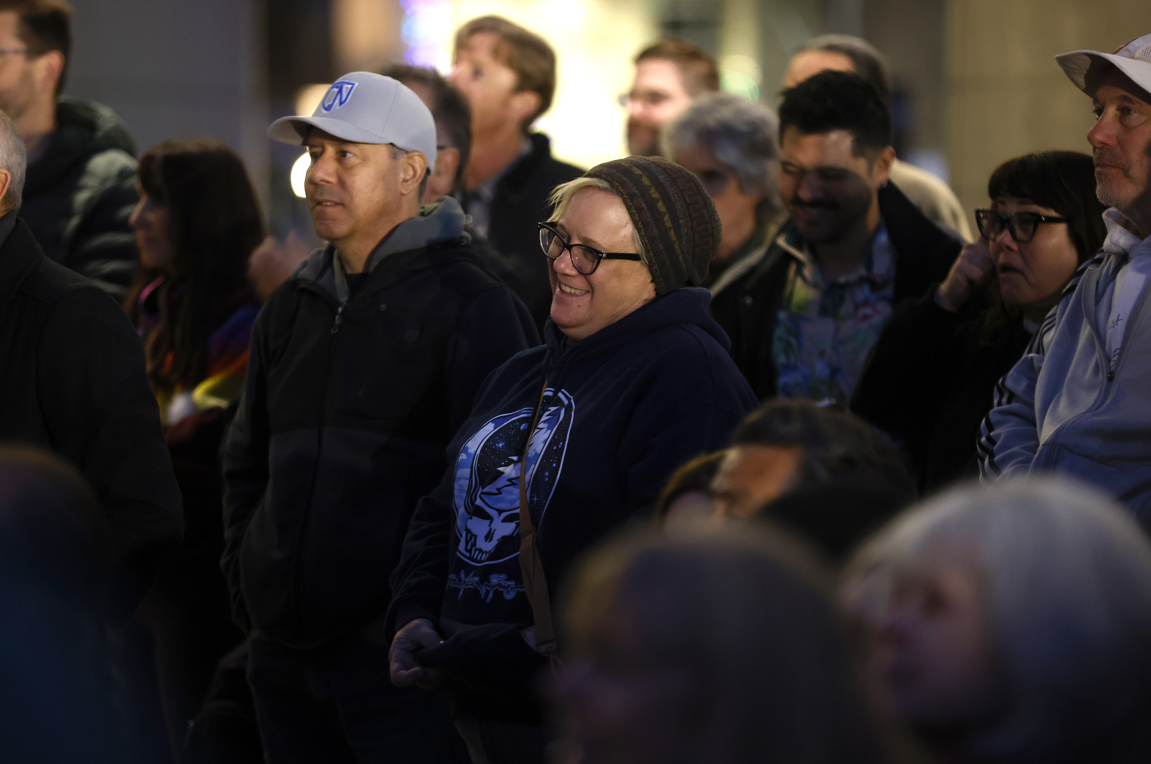 Fans listen to a speaker during a plaque unveiling at...