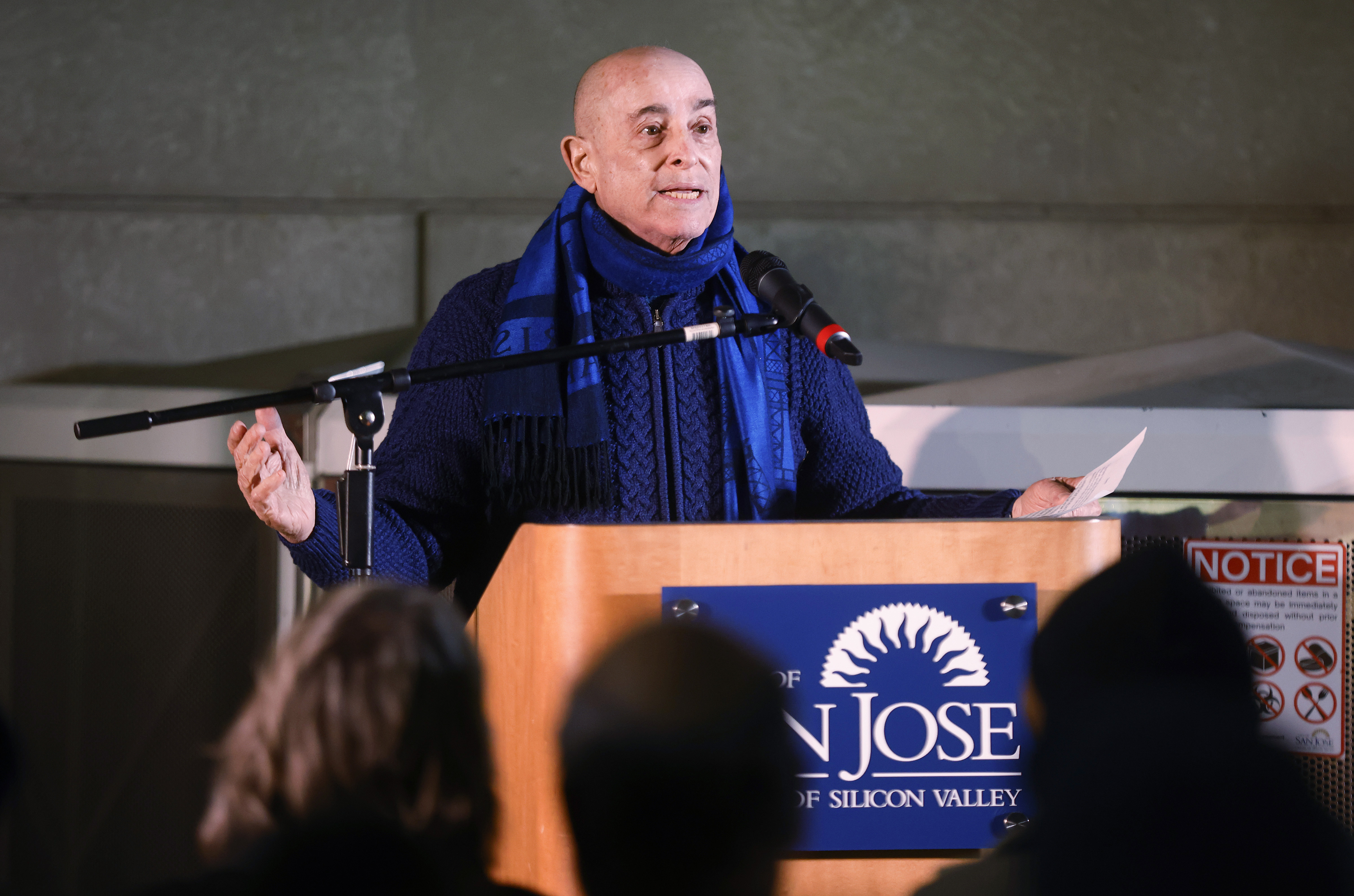 Ira Meltzer, who attended the concert, speaks during a plaque...