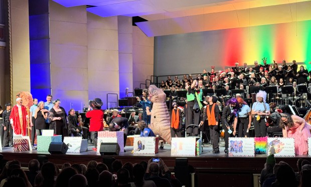 Inflatable dinosaurs, faux jewel thieves and a Pope Leo XIV impersonator were among the wild presenters for the "12 Days of Silicon Valley," a topical parody performed at Symphony San Jose's "Holiday Spectacular" at the California Theatre on Saturday, Dec. 6, 2025. (Sal Pizarro/Bay Area News Group)