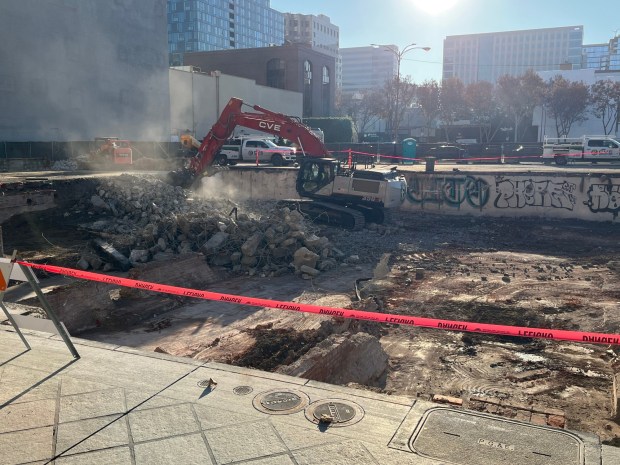 Construction equipment operates in a hole that is a remnant of a demolished building that was located at 39, 45, and 49 North First Street in downtown San Jose, seen on Dec. 8, 2025. (George Avalos/Bay Area News Group)