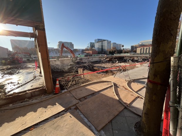 Construction equipment operates at the site of a bulldozed building that was located at 39, 45, and 49 North First Street in downtown San Jose, seen on Dec. 8, 2025. (George Avalos/Bay Area News Group)