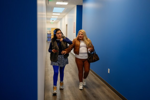 Kathia, who asked to withhold her full name to protect her family's privacy, right, walks with her daughter Briana, 12, at Bay Area Community Health in San Jose, Calif., on Thursday, Oct. 23, 2025. (Shae Hammond/Bay Area News Group)