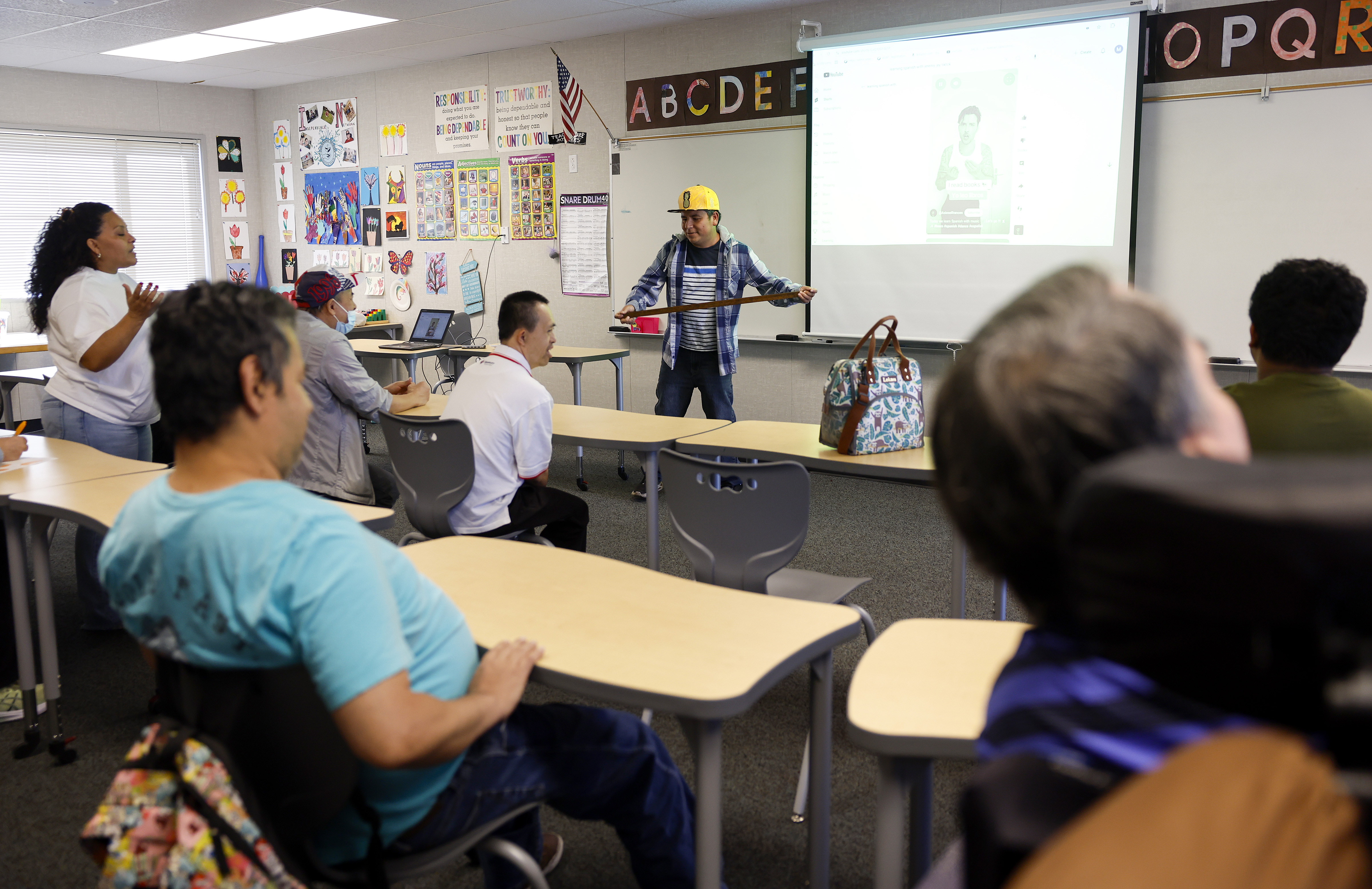 Student Cacho Reyes leads a workout/Spanish class called âAmigos Workoutâ...