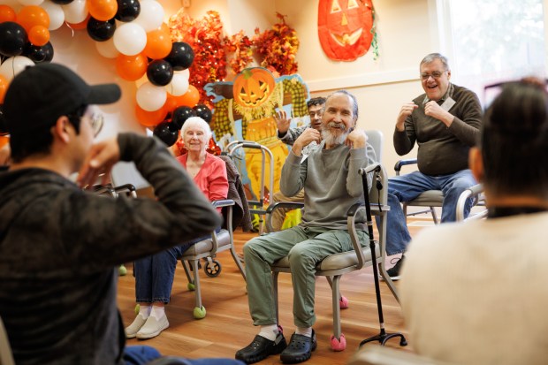 Seniors take part in a physical exercise session at Live Oak Adult Day Services in San Jose, Calif., on Nov. 4, 2025. (Dai Sugano/Bay Area News Group)