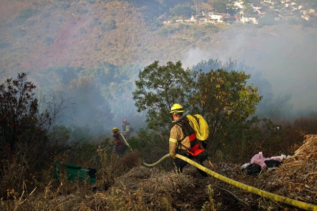 Firefighters respond to the Ariane fire in Clairemont on Tuesday, June 24, 2025, in San Diego. (Michael Ho / The San Diego Union-Tribune)