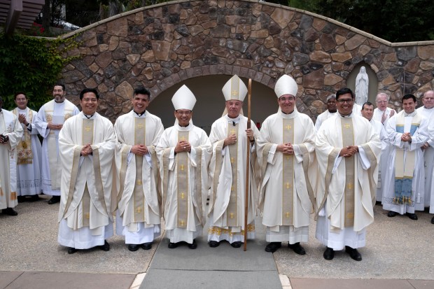 Three new priests were ordained in the Roman Catholic Diocese of San Diego on June 14, 2025, at St. Therese of Carmel Catholic Church in San Diego's Carmel Valley neighborhood. From left are Brian Frulla, Anthony Jimenez, Bishop Michael Pham, Auxiliary Bishop Ramón Bejarano, Auxiliary Bishop Felipe Pulido and Jesse Lopez. (David Maung / For the San Diego Catholic Diocese)