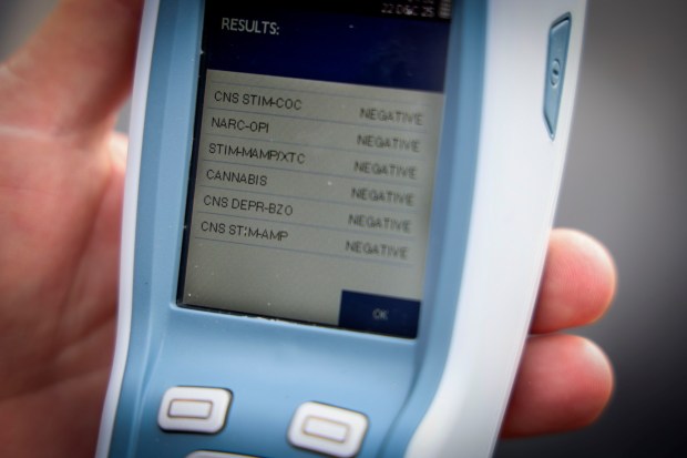 SDPD officer Anthony Bueno displays a readout with the departments new SoToxa, a small device which tests saliva to detect several types of drugs, on Monday, December 22, 2025 at their Murphy Canyon facility..( Photo by Sandy Huffaker for The San Diego Union-Tribune)