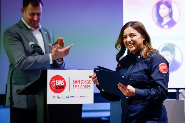 Alexia Lopez receives her certificate during San Diego Emergency Medical Services Corps graduation at Southwestern College on Tuesday, Dec. 2, 2025 in Chula Vista, California. (Meg McLaughlin / The San Diego Union-Tribune)