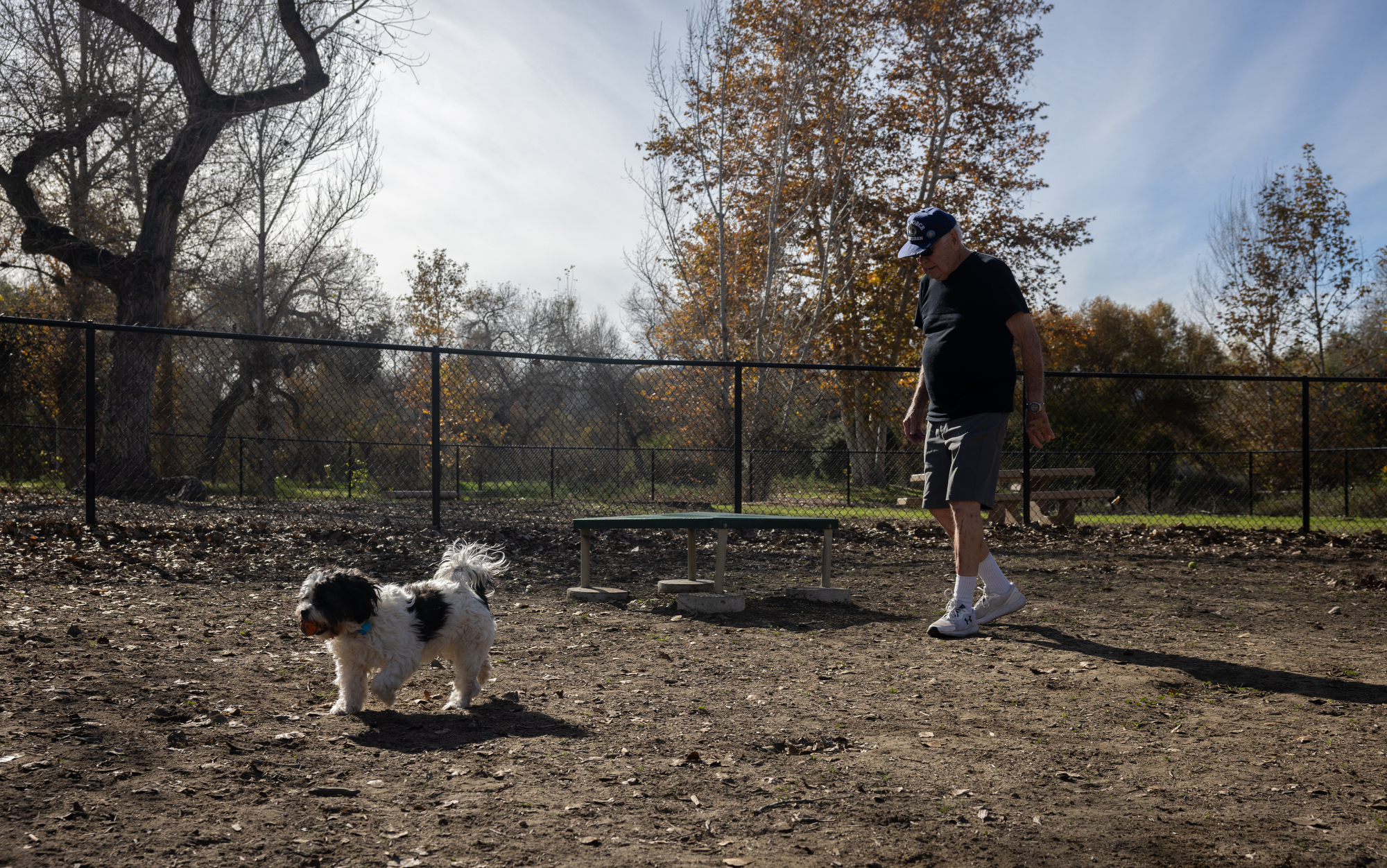 Cliff Leary plays fetch with his dog Doug at Mast...