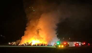 Firefighters spend hours dousing burning bales of hay in San Pasqual Valley