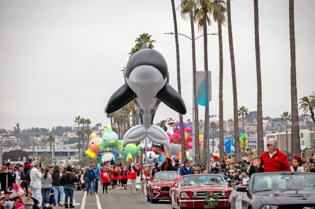 Thousands gather to watch marching bands, floats, giant balloons and other entertainment during the Port of San Diego Holiday Bowl Parade on Friday, Dec. 27, 2024 in San Diego, California. (Ana Ramirez / The San Diego Union-Tribune)