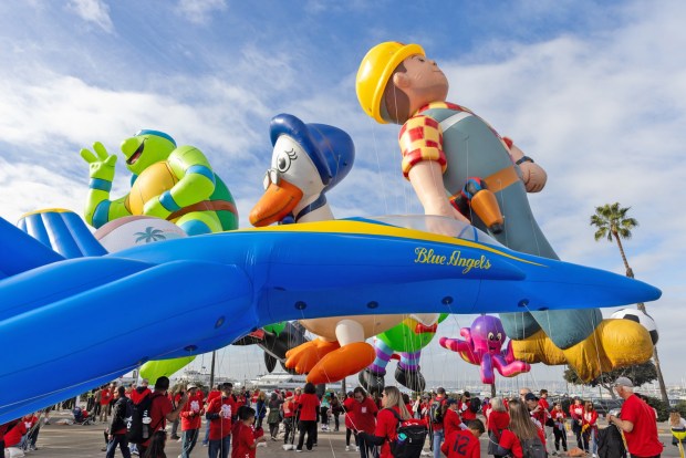 Thousands gather to watch marching bands, floats, giant balloons and other entertainment during the Port of San Diego Holiday Bowl Parade on Friday, Dec. 27, 2024 in San Diego, California. (Ana Ramirez / The San Diego Union-Tribune)