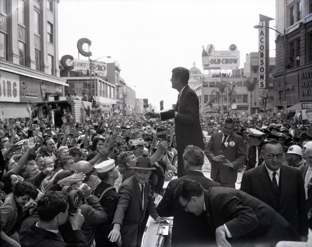 Sen. John F. Kennedy waves to the crowd during a campaign visit to San Diego on Nov. 2, 1960, in this photo by Thane Mcintosh.