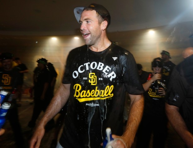 Nick Pivetta #27of the San Diego Padres celebrates in the clubhouse after beating the Milwaukee Brewers to secure a playoff spot at Petco Park on Sept. 22, 2025 in San Diego, CA. (K.C. Alfred / The San Diego Union-Tribune)