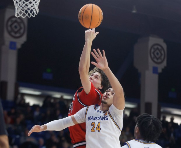 San Diego State Aztecs' Miles Heide (40) fights for a rebound against San Jose State Spartans' Douglas Langford (24) in the first half at the Provident Credit Union Event Center at San Jose State University in San Jose, Calif., on Tuesday, Dec 30, 2025. (Nhat V. Meyer/Bay Area News Group)