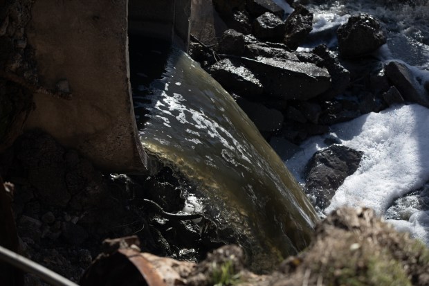 The Tijuana River flows on Dec. 11 in San Diego. (Ana Ramirez / The San Diego Union-Tribune)
