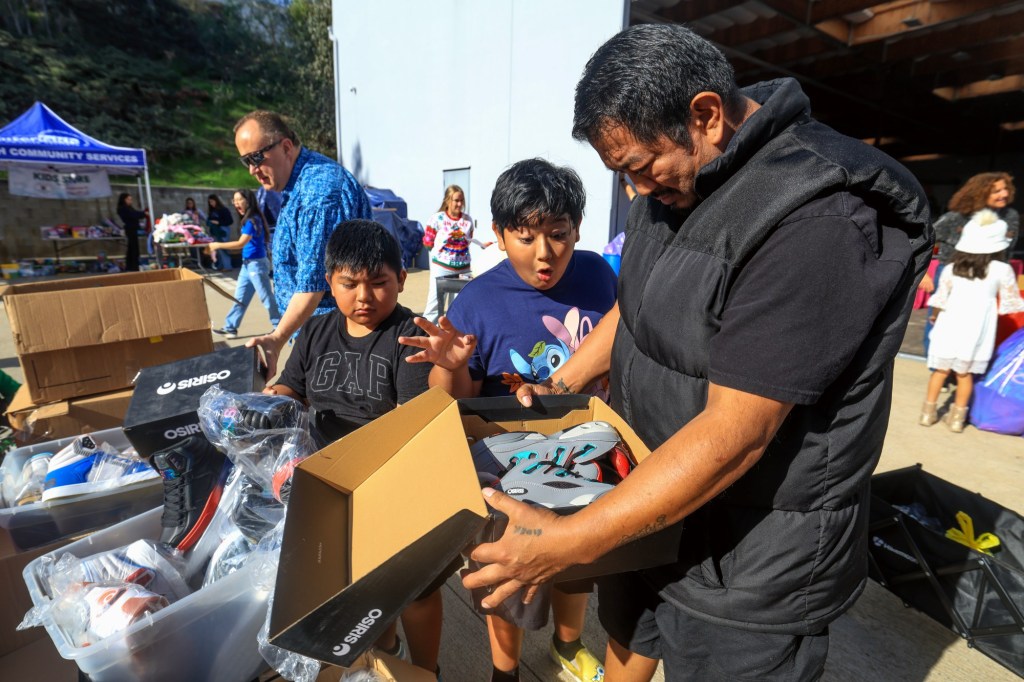 Families in need shop at holiday giveaway in Escondido