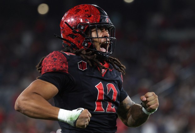 San Diego State linebacker Owen Chambliss lets out a yell as he celebrates breaking up a pass intended for Colorado State's Lloyd Avant in the second quarter at Snapdragon Stadium in San Diego on Friday, Oct. 03, 2025. (Hayne Palmour IV / For The San Diego Union-Tribune)