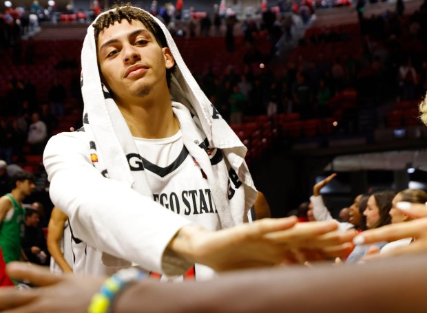 SDSU guard Miles Byrd celebrates with fans after a win against Utah Valley at Viejas Arena on Wednesday. (K.C. Alfred / The San Diego Union-Tribune)