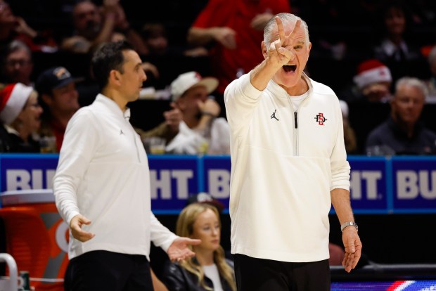 SDSU coach Brian Dutcher yells to players during their game against Air Force at Viejas Arena on Wednesday. (Meg McLaughlin / The San Diego Union-Tribune)