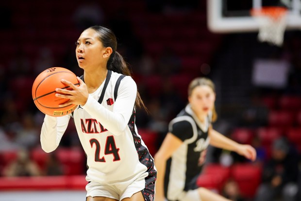 Naomi Panganiban #24 of San Diego State attempts a 3-pointer against Santa Clara during their game at Viejas Arena on Wednesday, Nov. 19, 2025 in San Diego, California. (Meg McLaughlin / The San Diego Union-Tribune)