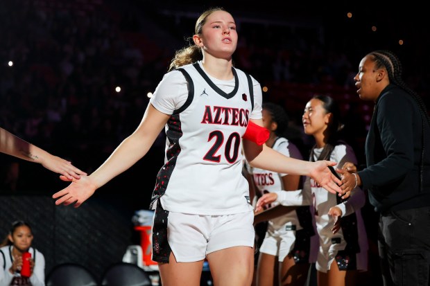Bailey Barnhard #20 of San Diego State is announced before their game against Santa Clara at Viejas Arena on Wednesday, Nov. 19, 2025 in San Diego, California. (Meg McLaughlin / The San Diego Union-Tribune)