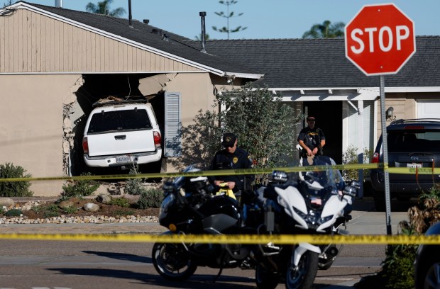 San Diego, CA - December 29: A woman died when a vehicle was driven into a home on Dakota Dr. near Fontana Ave. in Bay Park on December 29, 2025 in San Diego, CA (K.C. Alfred / The San Diego Union-Tribune)