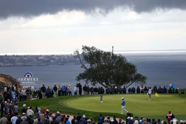 Golfers walk on the green of the fifth hole during the final round of the Farmers Insurance Open at Torrey Pines South Course on Saturday, Jan. 25, 2025 in San Diego, CA. (Meg McLaughlin / The San Diego Union-Tribune)