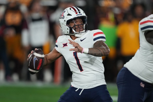 Arizona quarterback Noah Fifita (1) throws the ball against Arizona State in the first half of an NCAA college football game, Friday, Nov. 28, 2025, in Tempe, Ariz. (AP Photo/Rick Scuteri)