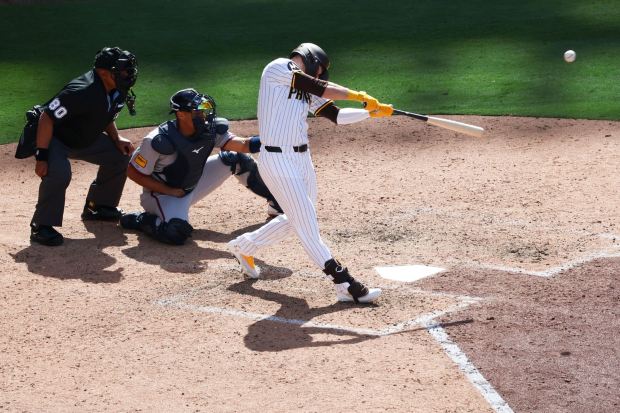 San Diego Padres' Gavin Sheets hits a home run against the Atlanta Braves in the seventh inning during Opening Day of the 2025 season at Petco Park on Thursday, March 27, 2025 in San Diego, CA. (Meg McLaughlin / The San Diego Union-Tribune)