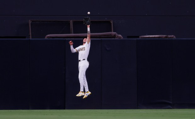 Jackson Merrill #3 of the San Diego Padres catches a fly ball in the first inning hit by Noelvi Marte #16 of the Cincinnati Reds at Petco Park on Sept. 10, 2025 in San Diego, California. (K.C. Alfred / The San Diego Union-Tribune via Getty Images)