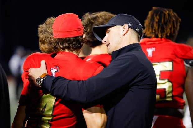 Santa Fe Christian's Baylen Brees #4 is comforted by his father Drew Brees during the Division 2-A Southern California Regional at Carlsbad High School on Saturday, Dec. 6, 2025 in Carlsbad, California. (Meg McLaughlin / The San Diego Union-Tribune)