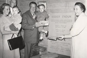 Terry Seidler holding John Seidler; Capt. Emil Praeger, engineer who helped O'Malley design and plan Dodger Stadium; Walter O'Malley holding grandson Peter Seidler; and Kay O'Malley.