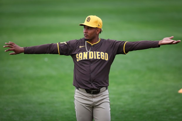 Jhony Brito stretches during Padres spring training workouts at the Peoria Sports Complex on Wednesday, Feb. 12, 2025 in Peoria, Ariz.. (Meg McLaughlin / The San Diego Union-Tribune)