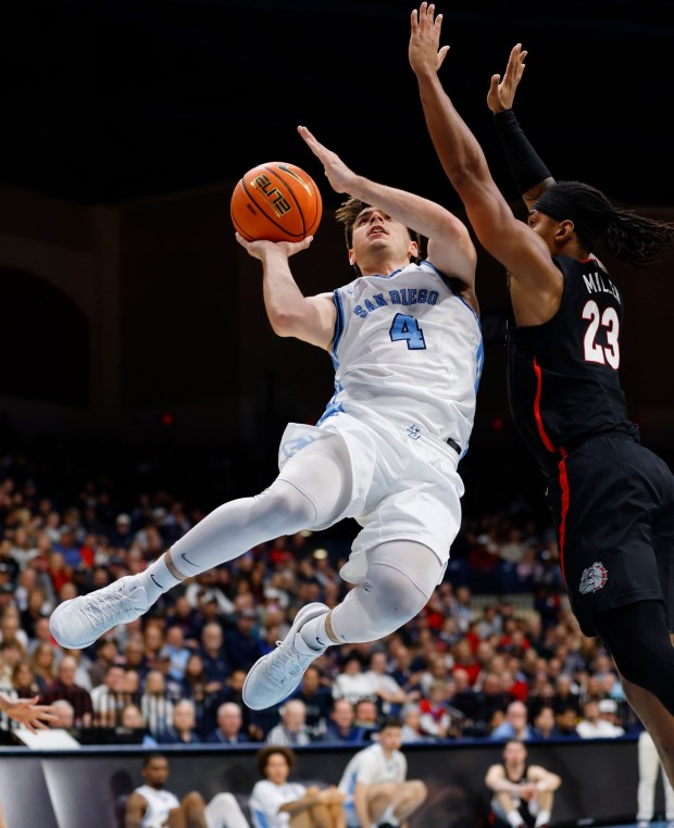 San Diego, CA - December 30: Juanse Gorosito #4 of University of San Diego shoots against Adam Miller #23 of Gonzaga on December 30, 2025 in San Diego, CA. (K.C. Alfred / The San Diego Union-Tribune)