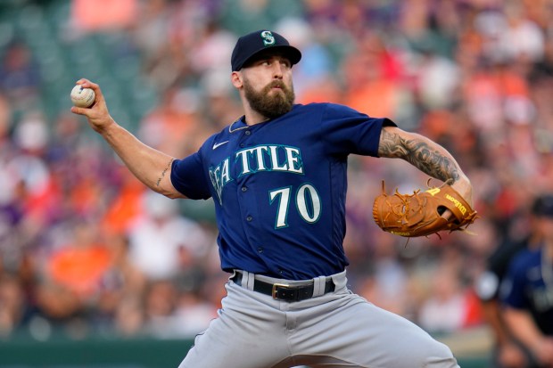 Seattle Mariners relief pitcher Ty Adcock throws a pitch to the Baltimore Orioles in the eighth inning of a baseball game, Saturday, June 24, 2023, in Baltimore. The Orioles won 6-4 in 10 innings. (AP Photo/Julio Cortez)