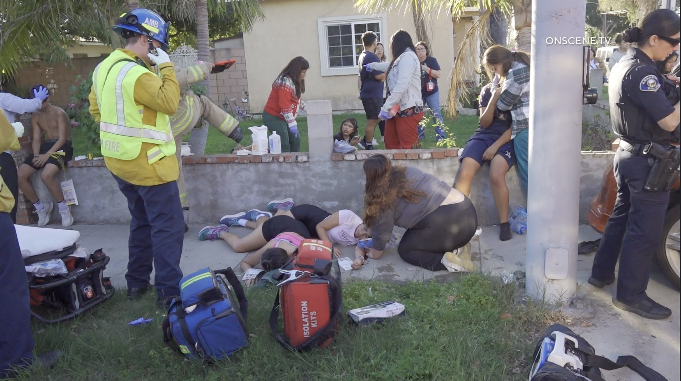 At least eight members of an Anaheim High School running...