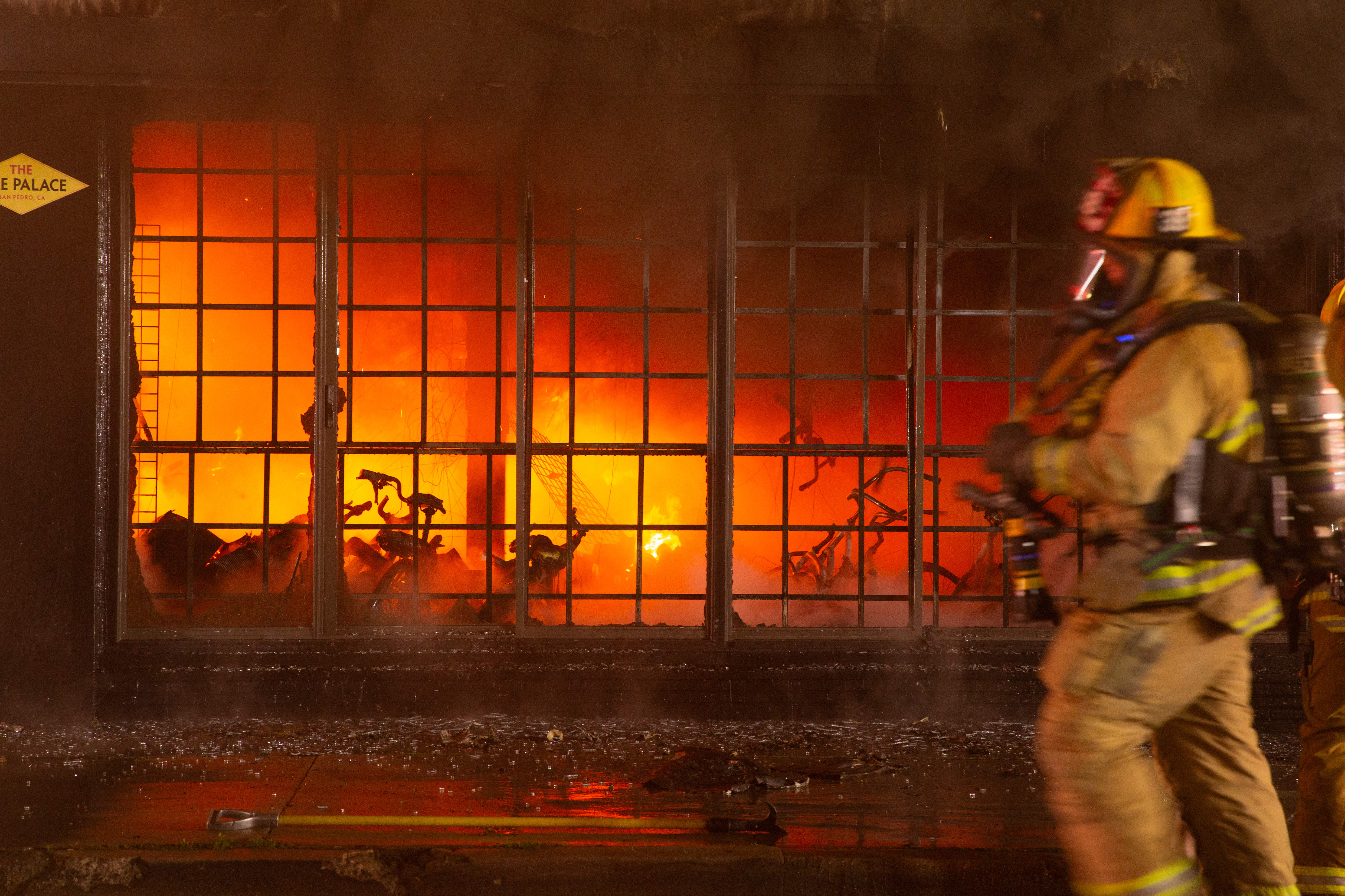 Bicycles burn as firefighters battle a blaze in The Bike...