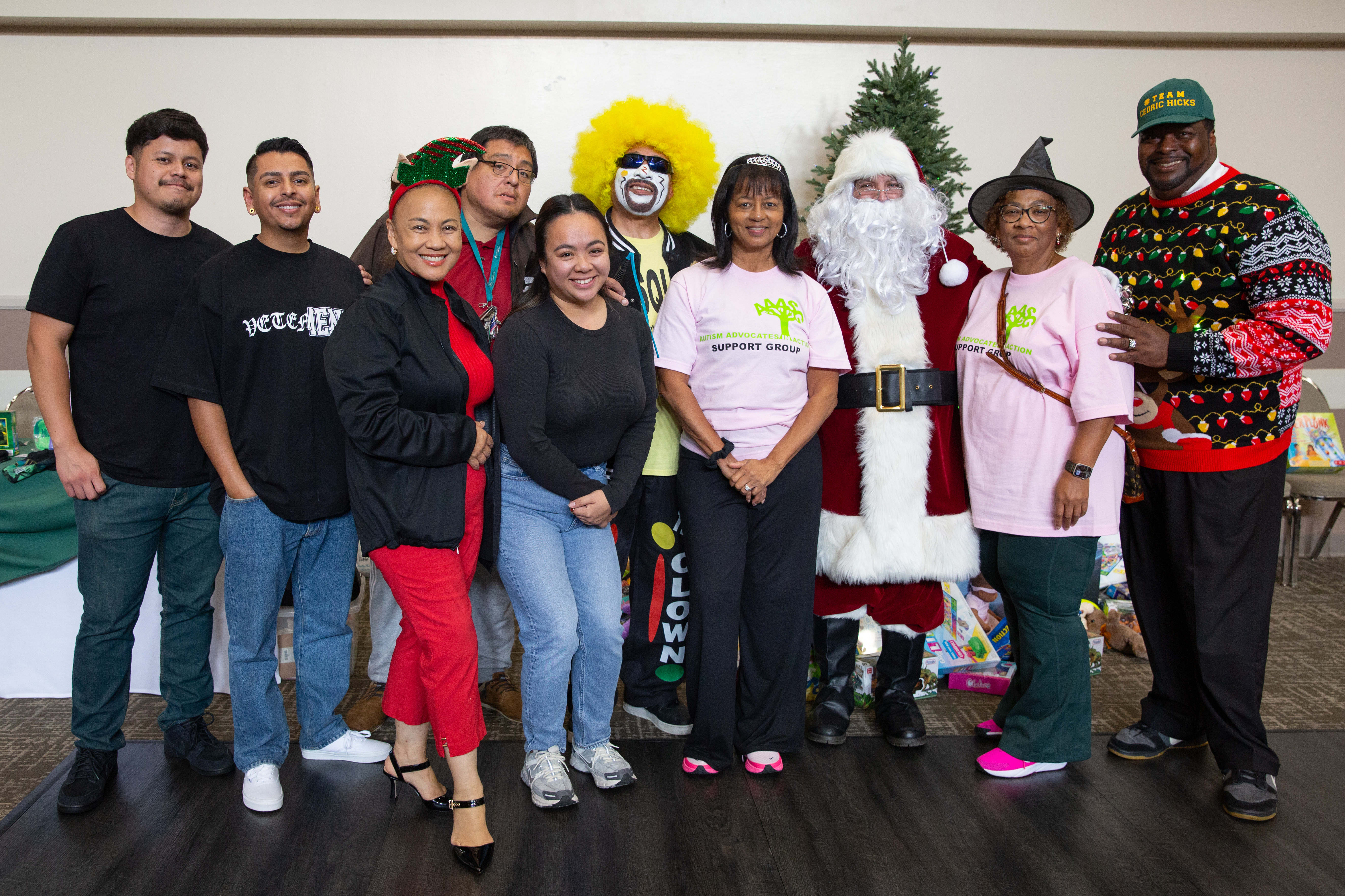 City officials, volunteers, community organizers and Santa Claus take a...