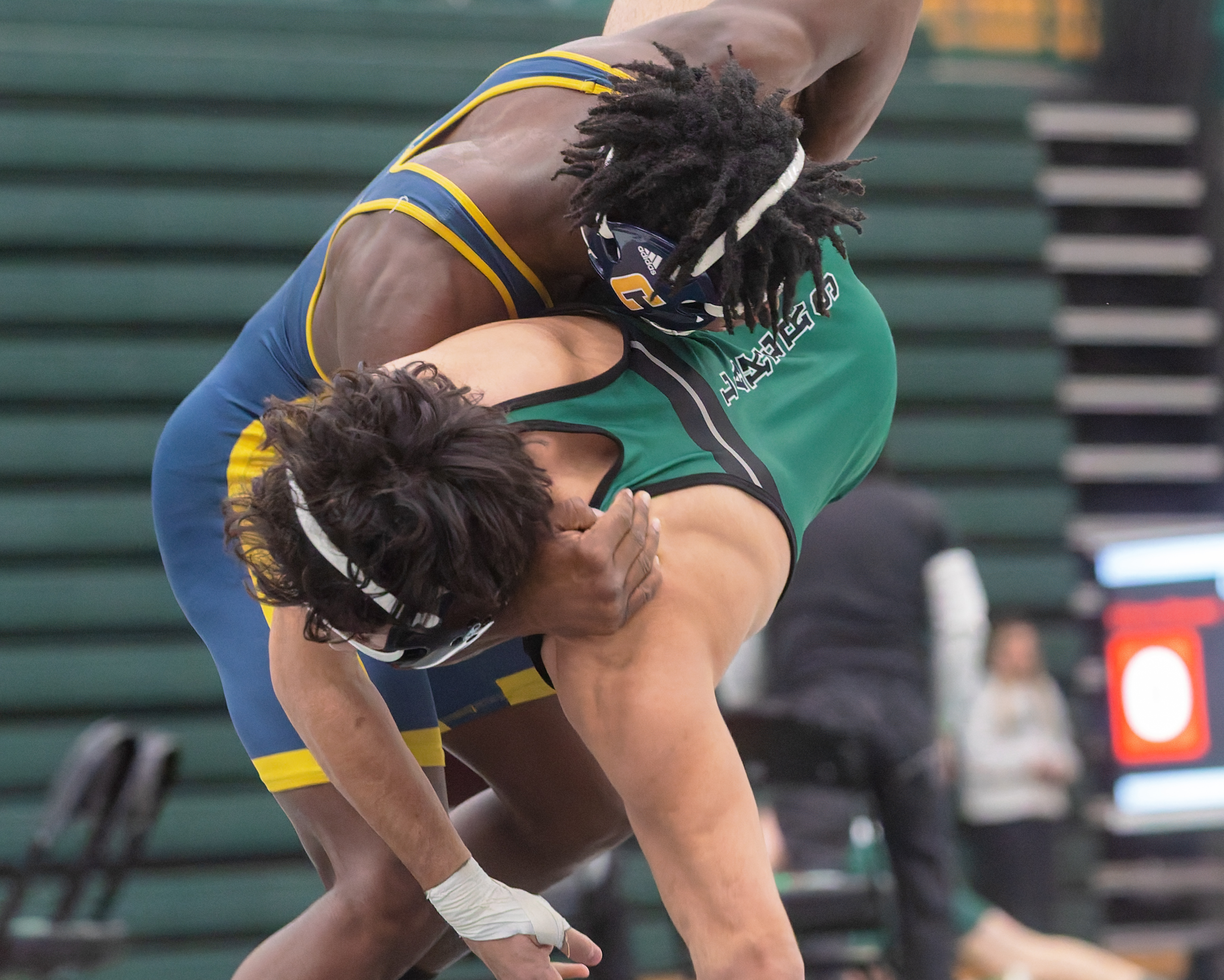 Clarkston's Nate Carter (left) defeated West Bloomfield's Christian Ausi 18-2...
