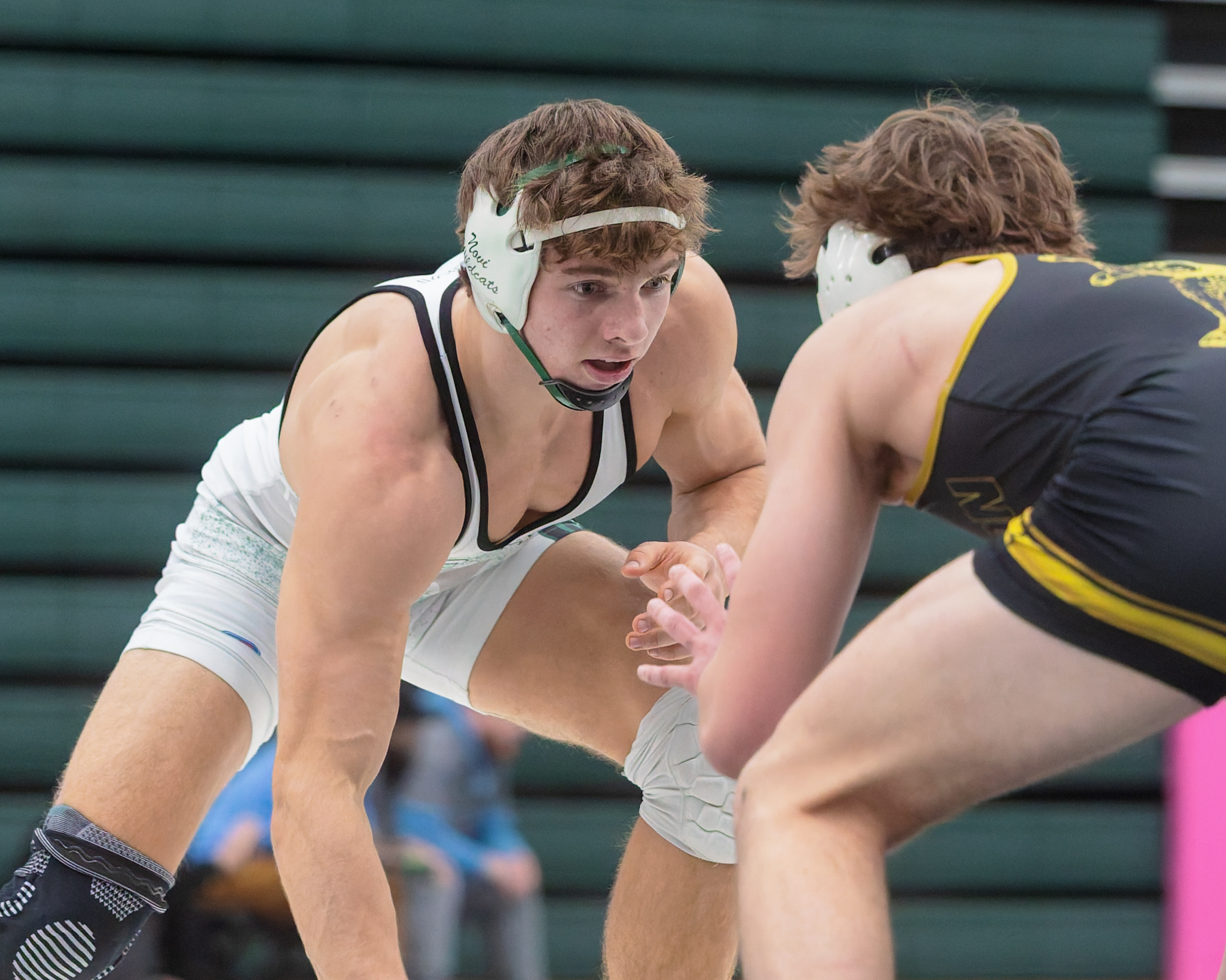 Clarkston's Ayden Mutter (right) defeated Novi's Anthony Madafferi 9-8 to...