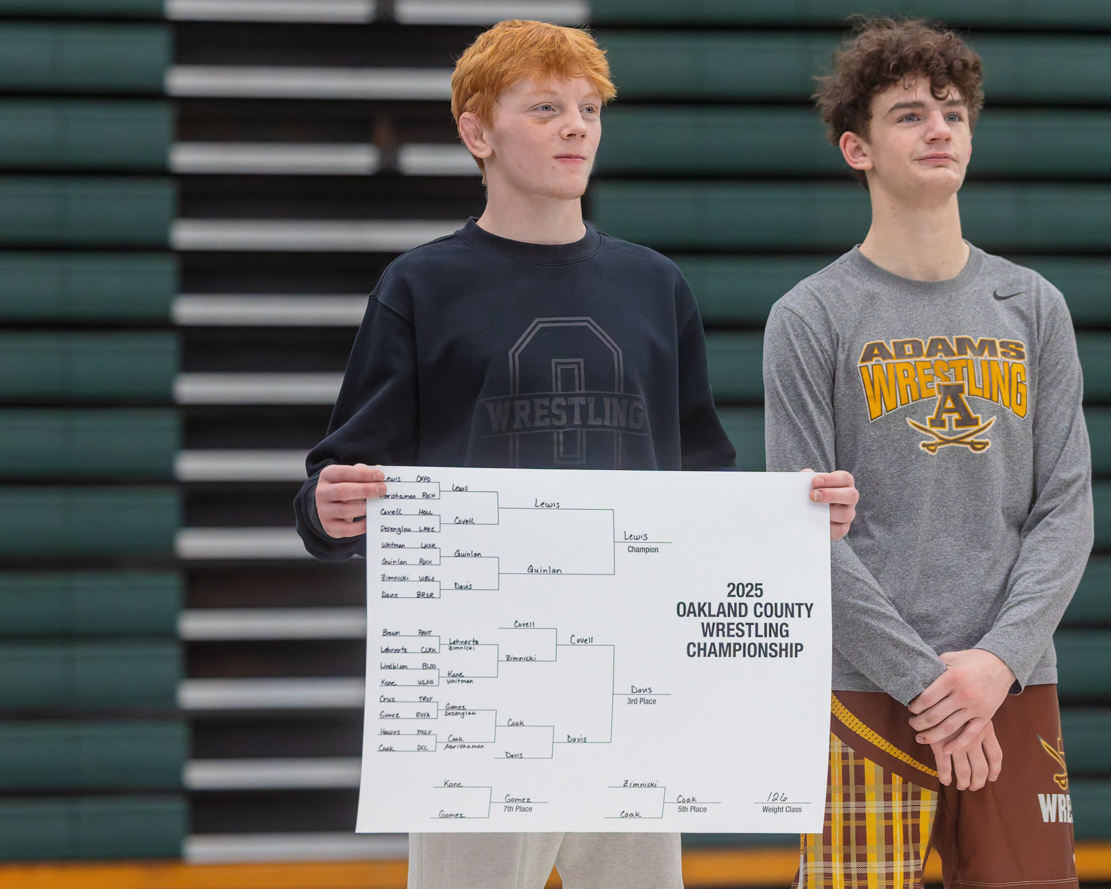 Oxford's Gavin Lewis (left) took home the Oakland County Championship...