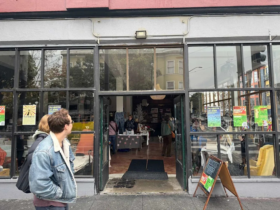 Pedestrians walk by Harrington Gallery on Valencia St, in San Francisco, which was hosting a pop up holiday market as the power went out on Saturday. (Aidin Vaziri/S.F. Chronicle)