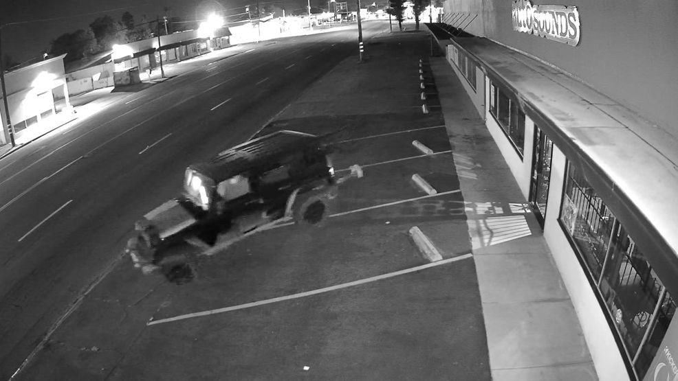 Police released video of one of the offenses, showing a Jeep backing into and slamming an unknown object into the front entrance of the Auto Sounds store. CREDIT: BPD