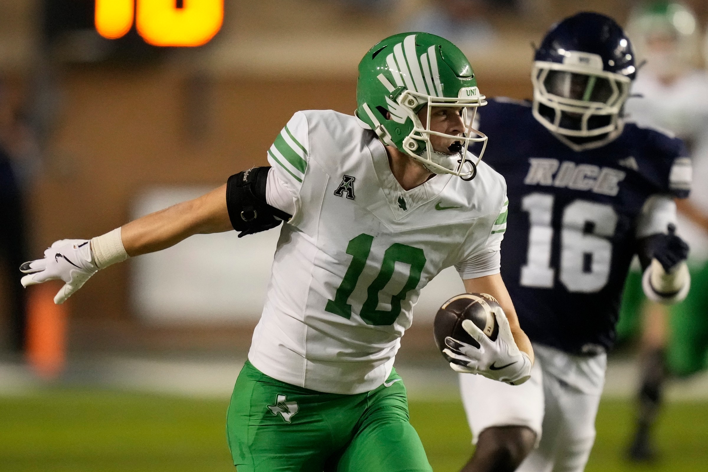 HOUSTON, TEXAS - NOVEMBER 22: Wyatt Young #10 of the North Texas Mean Green runs for a touchdown during the second quarter against the Rice Owls at Rice Stadium on November 22, 2025 in Houston, Texas. (Photo by Kevin M. Cox/Getty Images)